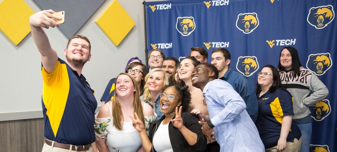 Students gather for a group selfie